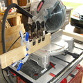 Rigged up a jig on the miter saw to allow me to quickly cut all the rails the same size.