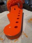 Shaped and now painting the headstock.