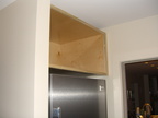The cabinet over the fridge is installed.