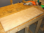 Boards are cut, drilled, biscuited, dry fitted, and sanded.  This is the inside of one of the sides.