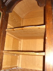 Closeup of the shelves in the top of the buffet.  The lines on the front of the shelves are inlaid wood.